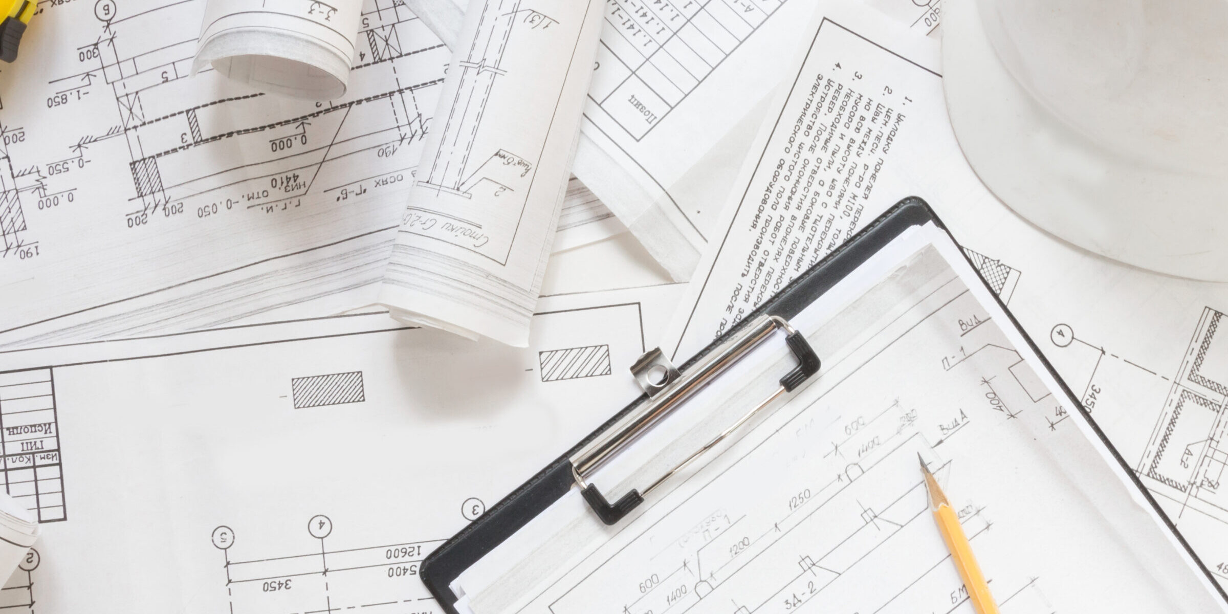 architect design working drawing sketch plans blueprints and making architectural construction model in architect studio,flat lay